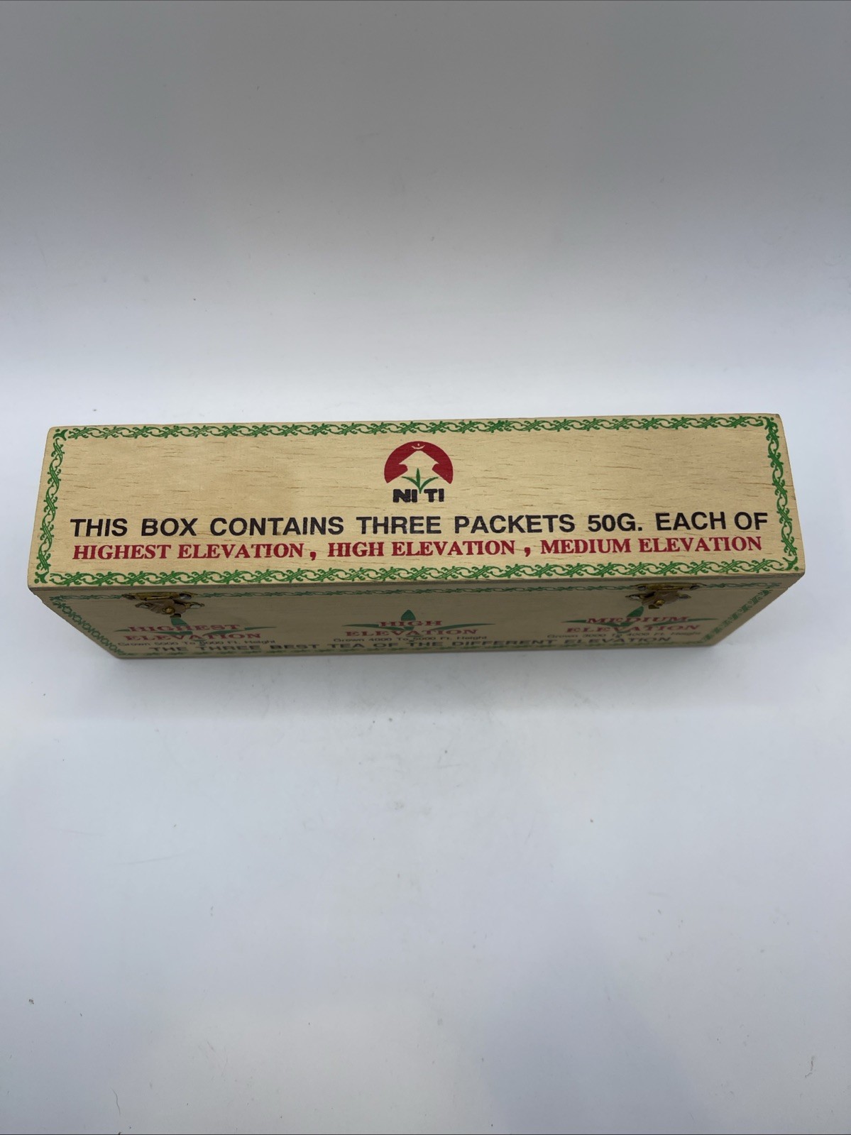 Wooden Tea Box from Niti Labeled “Three Packets 50G” from Different Elevations