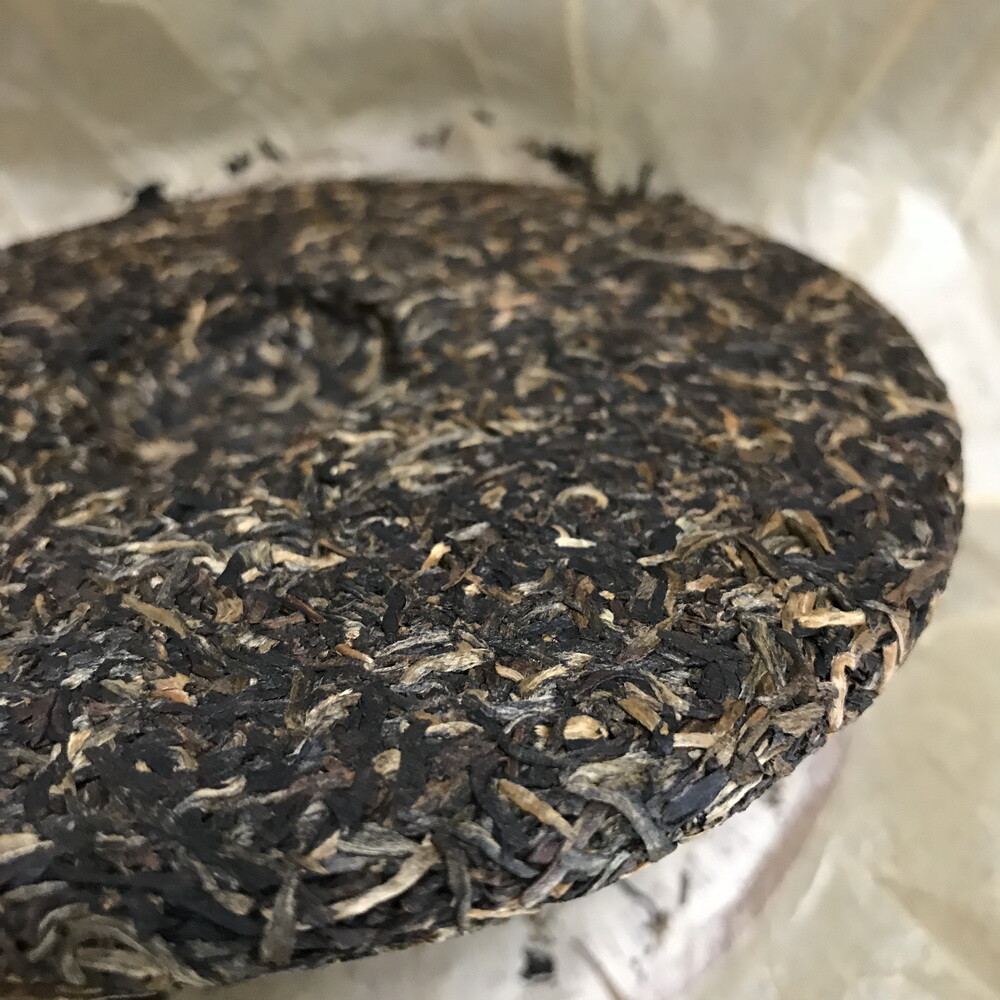 2006 Silver Needle Tributary Puer Meng Hai Qiao Mu Ye Sheng Cha Raw Pu’er 250g